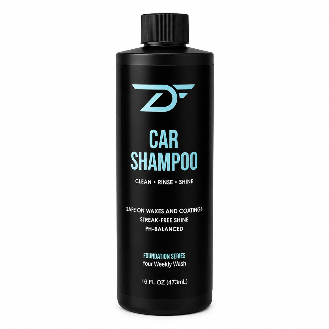 A 16 fl oz black bottle of Detailers Finest Foundation Series Car Shampoo with a black cap, featuring light blue and white text on a clean white background.