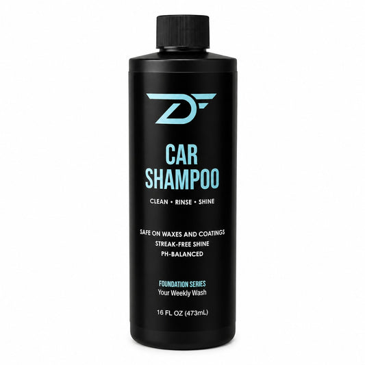 A 16 fl oz black bottle of Detailers Finest Foundation Series Car Shampoo with a black cap, featuring light blue and white text on a clean white background.